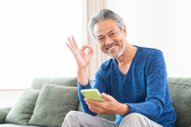 istock elderly man who uses smart phone, 1359758915