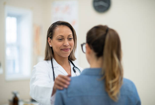 istock Doctor Comforting a Patient 1359760268