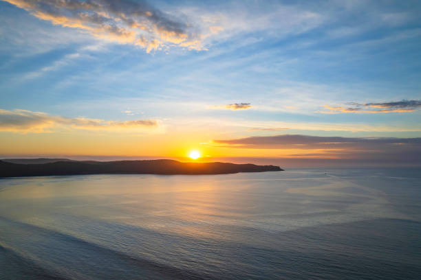 istock Sunrise seascape with a mix of high and medium clouds 1359761049