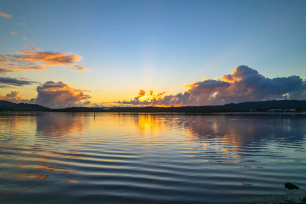 istock Aerial sunrise waterscape with ripples and reflections 1359761050