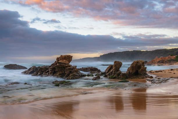 istock Rocks and waves - sunrise seascape at Bermagui 1359761099