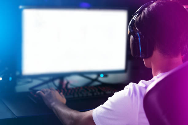 istock Rearview shot of a man playing computer games 1359761878