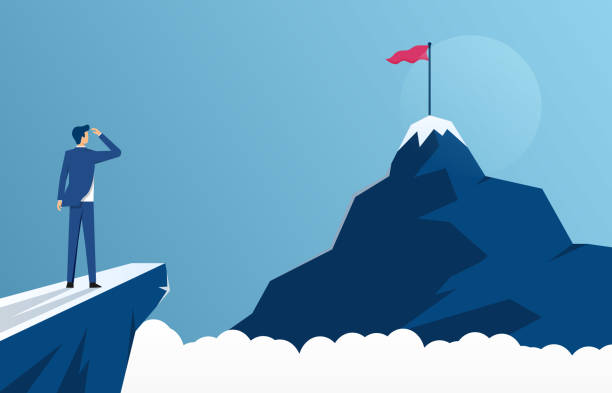 istock businessman standing on cliff's edge and looking at the mountain, business concept challenge and the goal 1359762042