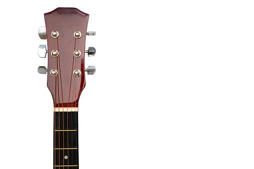 Acoustic guitar on white background, The guitar body pattern is wood grain