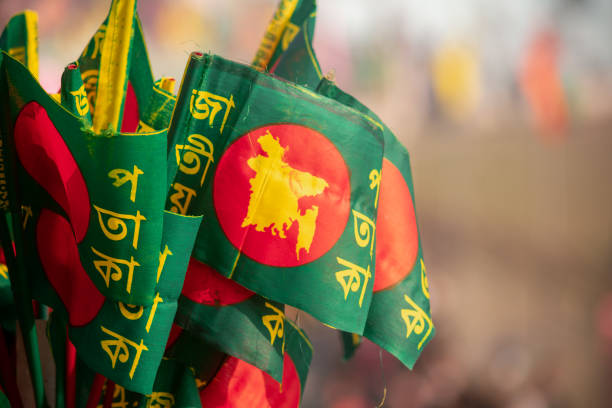 Bunch of Bangladeshi flags Hawkers selling Bangladeshi flags in the stadium on Victory day. bangladesh stock pictures, royalty-free photos & images