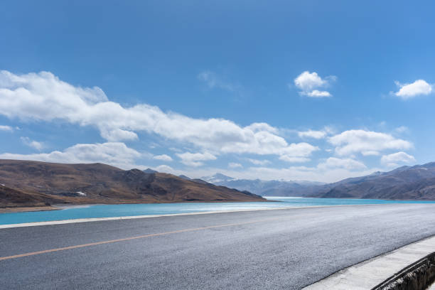 highway by the holy lake in Tibet, empty asphalt road background