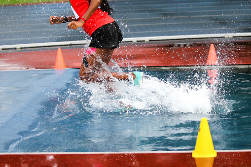 Athlete in steeplechase competition.