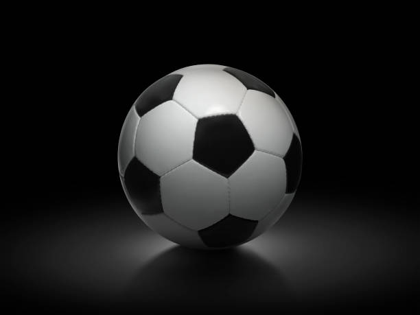 istock Soccer ball on black background 1359783256