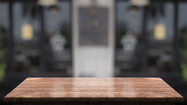 istock Empty wooden table top with lights bokeh on blur restaurant background. 1359784108