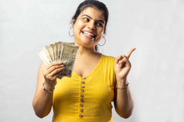 istock Indian woman with money 1359785214