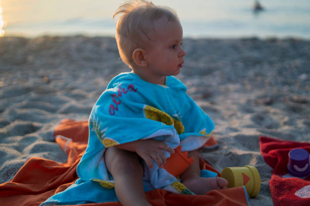 istock Baby at the beach 1359787852