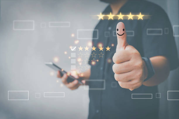 istock Customer review satisfaction feedback survey concept,customer hand with thumb up Positive emotion smiley face icon and five star, User give rating to service experience on application. 1359788616