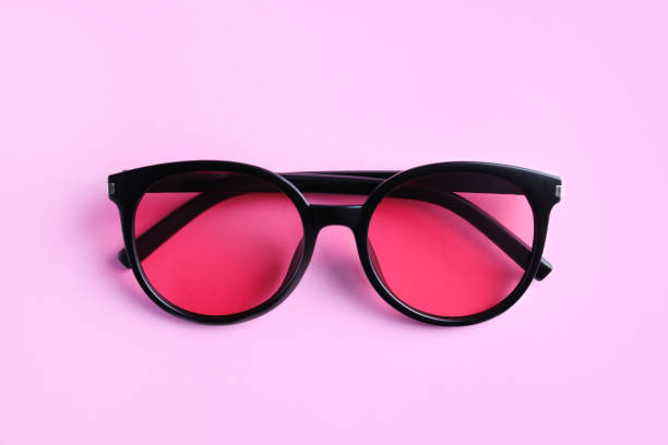 istock Stylish sunglasses on light violet background, top view 1359789366