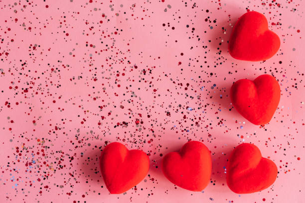 istock Happy Valentine's day text on pink background with hearts. Holiday concept 1359790105