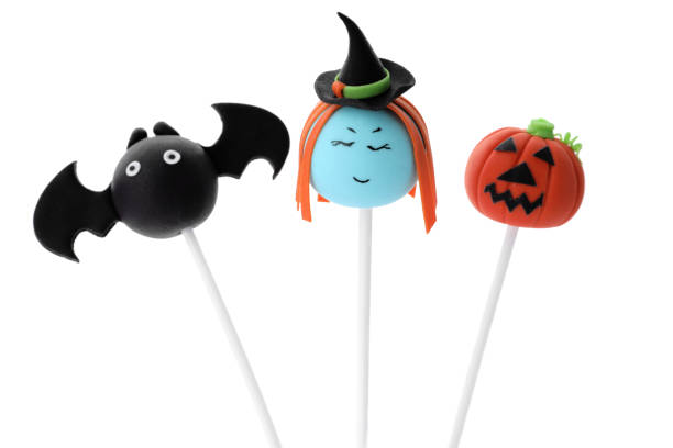 istock Delicious Halloween themed cake pops on white background 1359792261