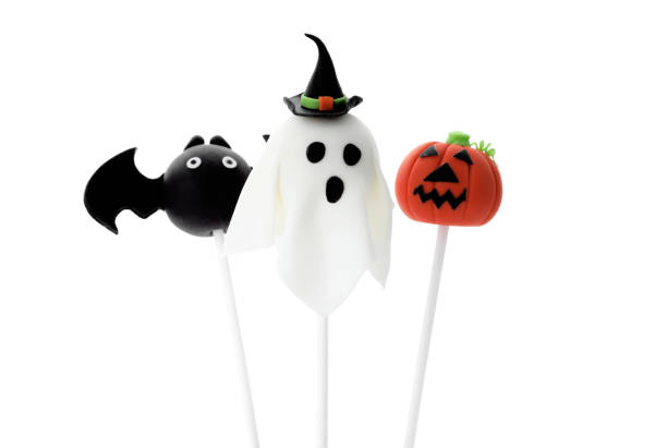 istock Delicious Halloween themed cake pops on white background 1359792916