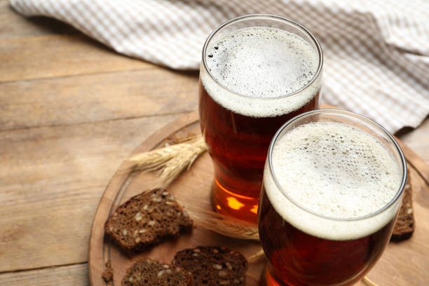 istock Delicious kvass, bread and spikes on wooden table. Space for text 1359794204