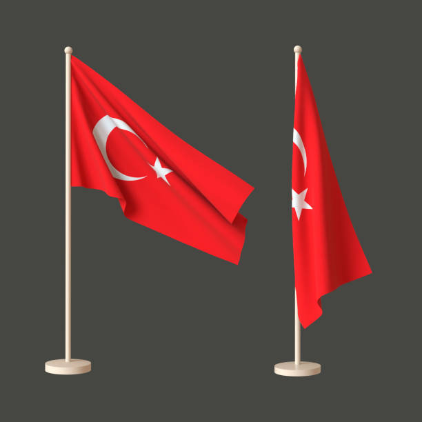 istock Two flags of Turkey on a neutral background - one fluttering on a flagpole, the other twisted tabletop. 3D rendering. Layout. Blank for design. Isolated. 1359794831