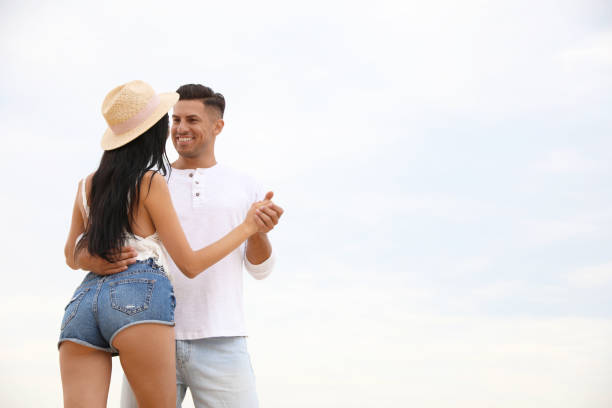 istock Lovely couple spending time together outdoors. Space for text 1359796349
