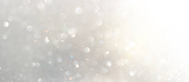 istock background of abstract gold and silver glitter lights. defocused 1359796554