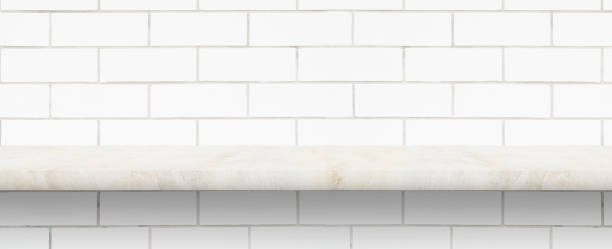 istock perspective of polished  marble tabletop and white brick wall for interior and display show products. studio room 1359796574