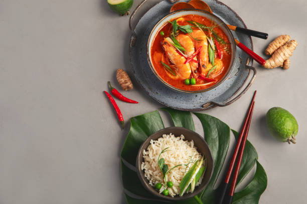 istock Red curry with chicken in bowl on light gray background. 1359797754