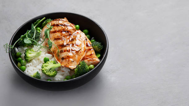 istock Grilled chicken with green vegetables and rice. 1359797796