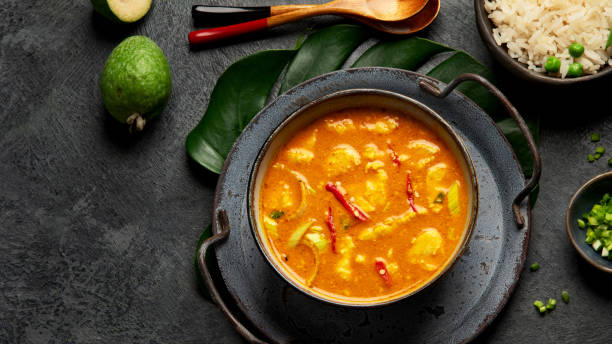 istock Yellow curry with chicken in bowl on dark background. 1359797868