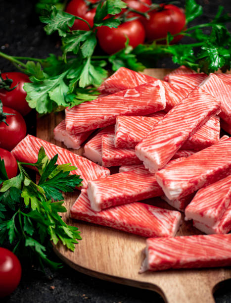 istock Fresh crab meat on a cutting board with parsley and tomatoes. 1359802218