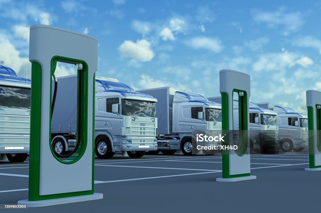 Clean energy logistics ideas Electric trucks in charging station Electricity Stock Photo