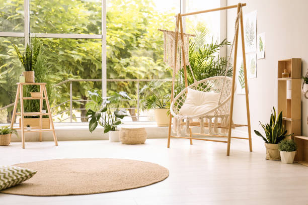 istock Comfortable hammock chair in stylish room. Home interior 1359804269