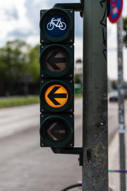 istock Bicycle traffic light with yellow arrow to the left 1359805230