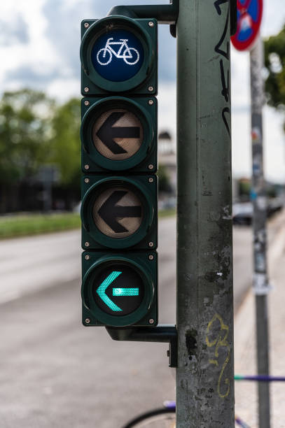 istock Bicycle traffic light with green arrow to the left 1359805269