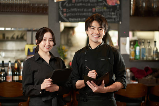 istock Asian men and women working in restaurants 1359805490