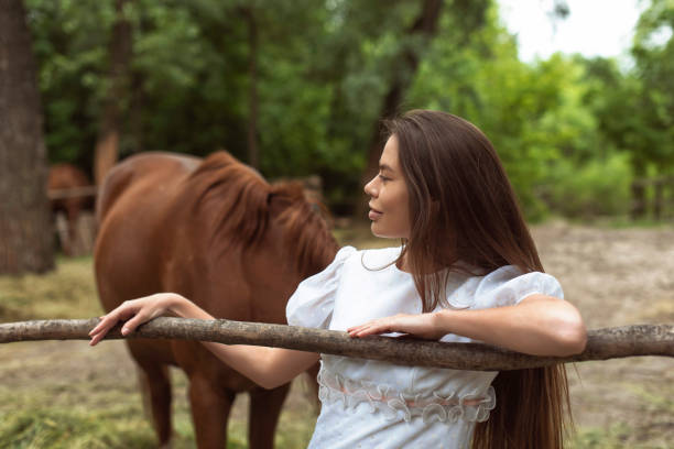istock Walk with a horse near the river 1359806040