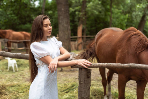 istock Walk with a horse near the river 1359806099