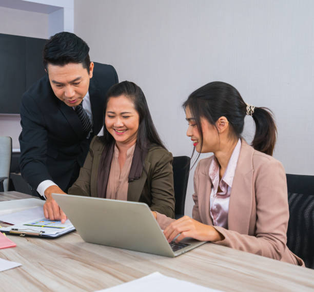 istock manager point report for young happy worker in business meeting 1359806520