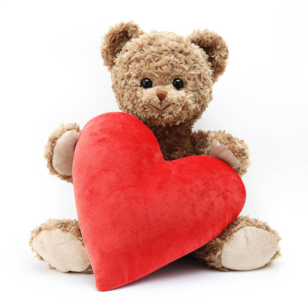 istock teddy bear with red heart isolated on white background 1359808201