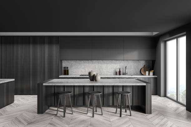istock Dark grey breakfast bar with kitchen cabinet on background 1359811559