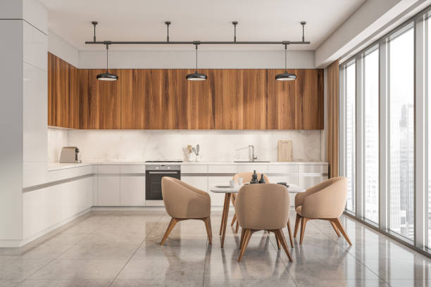 istock White kitchen interior with eating table and chairs on concrete tiled floor 1359811732