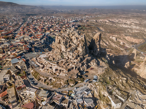 Uchisar natural rock castle and carved houses in Cappadocia, Turkey.