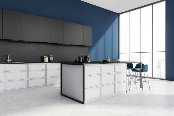 istock Stylish kitchen interior with table and chairs on white floor and window 1359812620