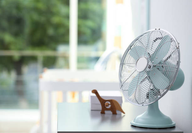 istock Modern fan on commode in baby room. Space for text 1359815897