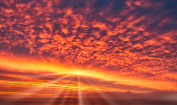 Spectacular Sunrise Sky in Yellow, Orange and Red Colors with Sun and Sunrays Spectacular sunrise sky in strong, bright yellow, orange and red colors with sun and sunrays. Sky replacement. cinematic music photos stock pictures, royalty-free photos & images