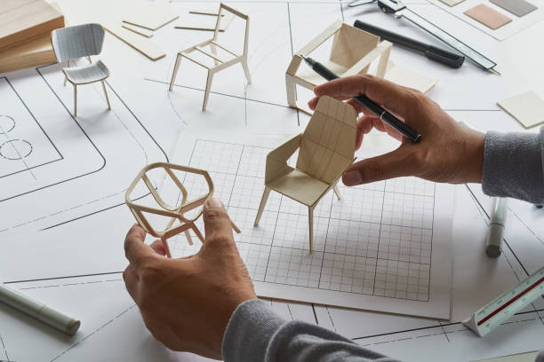 istock Designer sketching drawing design development product plan draft chair armchair Wingback Interior furniture prototype manufacturing production. designer studio concept . 1359822886