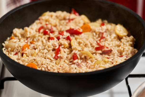 istock Risotto with vegetables in the pan 1359823480