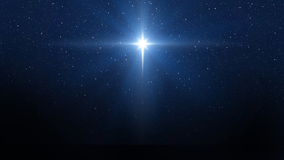 Background of beautiful dark blue starry sky and bright star. Christmas star of the Nativity of Bethlehem, Nativity of Jesus Christ