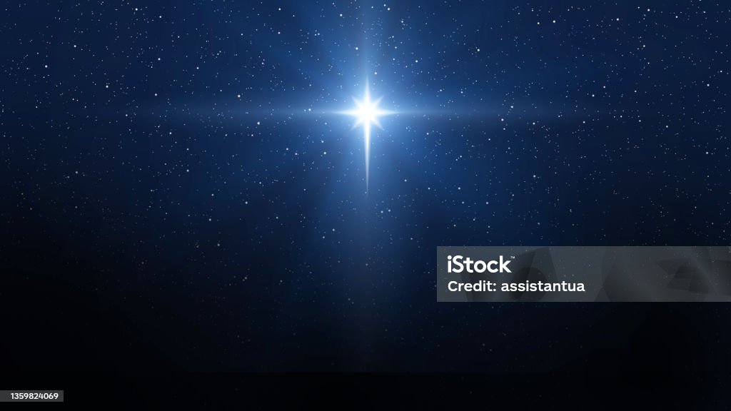 Background of beautiful dark blue starry sky and bright star. Christmas star of the Nativity of Bethlehem, Nativity of Jesus Christ Nativity Scene Stock Photo