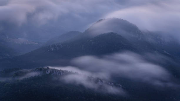 Blancafort castle, between fogs, at sunrise (Berguedà, Catalonia, Spain, Pyrenees) stock photo