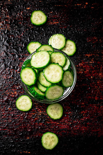 istock Sliced cucumbers in a glass bowl. 1359826787